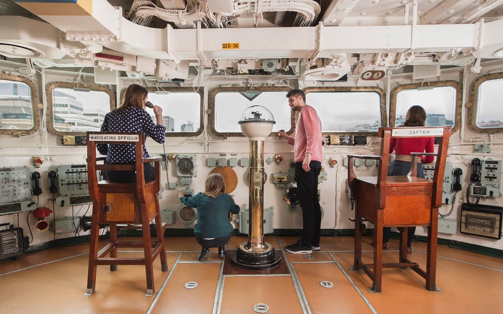 HMS Belfast - A family exploring the captain's deck inside the HMS Belfast